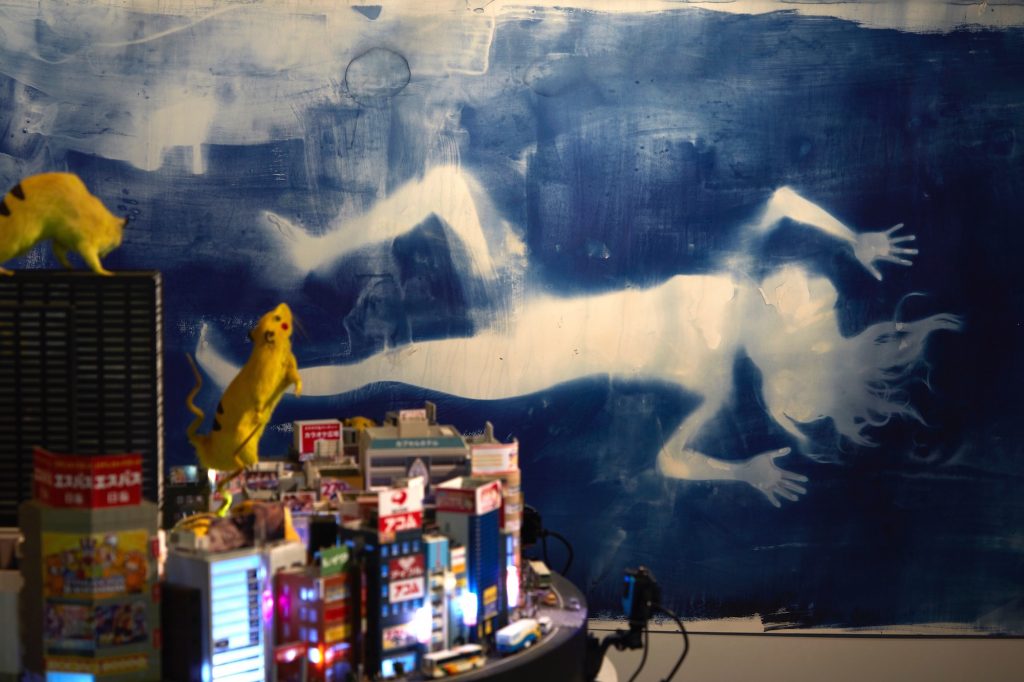 Drawing Mirai, 2016, The silhouette of Kabukicho’s sex worker Mirai (age 18) is printed on the wall using blueprinting. Sex industry, sexual minorities, violence, culture, entertainment and aliens... Kabukicho continued to allow various ways of living. Chim↑Pom depicted the figure of Mirai, with a self claimed name which also means future, in this place where many lives intersect.  